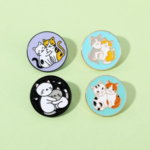 Set of four colorful enamel cat pins in purple, blue, black and mint green metal