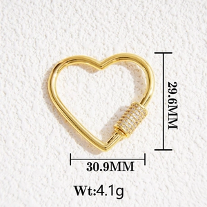 Detailed view of heart-shaped brass lobster clasp with pavé cubic zirconia screw lock