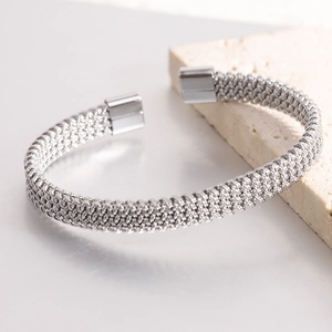 Detailed view of silver braided mesh cuff bracelet with magnetic square clasp closure