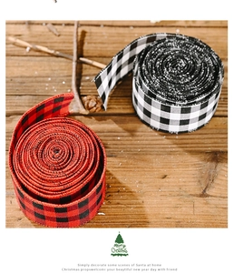 Close-up of red, black, and white checkered glitter ribbons for Christmas gift wrapping