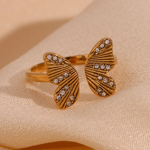 Macro shot of 18K gold plated butterfly wing ring featuring sparkling zircon inlay details