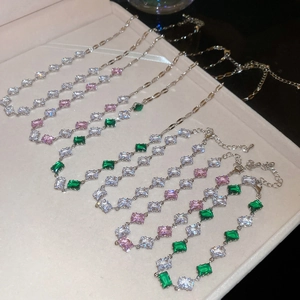 Collection of silver bracelets with emerald-cut zircon stones in pink and green