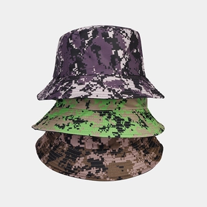 Detail of three stacked digital camouflage bucket hats showing reinforced stitching and colors