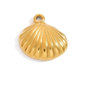 Close-up of a polished golden shell pendant with a smooth metallic surface finish