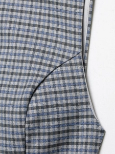Detailed view of blue-grey plaid fabric showing smooth texture and high-quality stitching