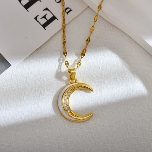 Elegant gold moon pendant necklace with white enamel and cubic zirconia stones