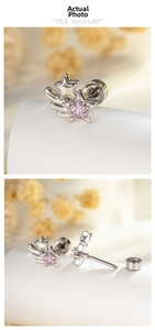 Detail of silver shooting star ear stud with pink heart zircon and screw back