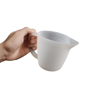 Close-up of a 250ml translucent silicone measuring cup with scale marks and spout