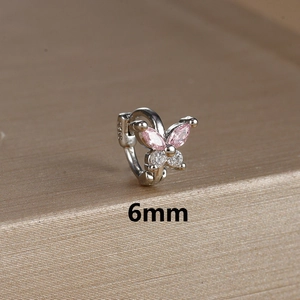 Macro shot of 6mm silver butterfly earring with pink marquise and white round zircons