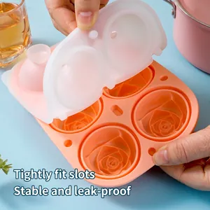 Silicone rose ice cube mold with orange base and secure locking lid for whiskey