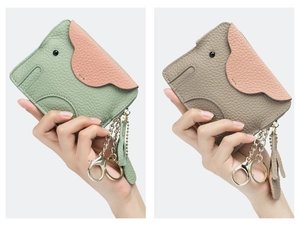 Detailed view of elephant-shaped leather coin purses with litchi texture and tassels