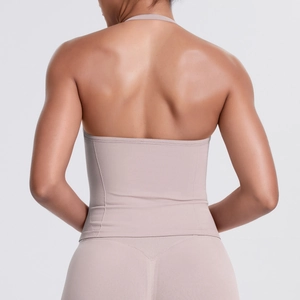 Detailed back view of beige cross-back sports bra with high-elastic compression fabric