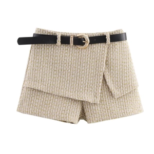 Detail of tweed skort with overlapping front, fringe edges and black belt with golden buckle