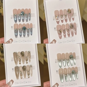 Handmade cat-eye press-on nails set with luxury rhinestone accents in four vibrant colors
