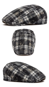 Detail view of the vintage washed plaid ivy cap showing fabric texture and stitching