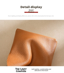 Close-up of brown genuine cowhide leather with high-quality lychee grain texture