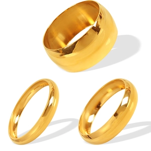 Polished gold titanium steel ring set with wide band and two minimalist stackable bands