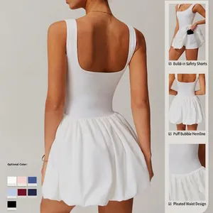 White backless athletic dress with pleated skirt and built-in shorts for running and tennis