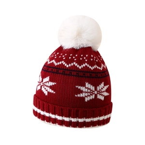 Winter kids red Christmas knit beanie with white snowflake patterns and soft pompom