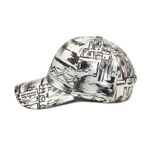 Side view of metallic silver baseball cap with black graffiti prints and street style