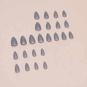 24-piece set of grey-blue cat eye press-on nails with marble texture and glitter detail