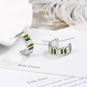 Silver C-shape geometric hoop earrings with green gradient enamel on minimalist card