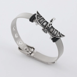 Gothic silver stainless steel mesh bracelet featuring a vintage eagle charm on white background