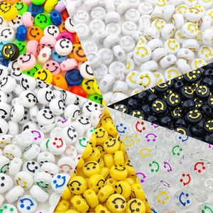 Macro view of assorted colorful acrylic smiley face beads for DIY jewelry making