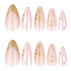 French almond press-on nails with 3D pearls and gold relief patterns on nude base