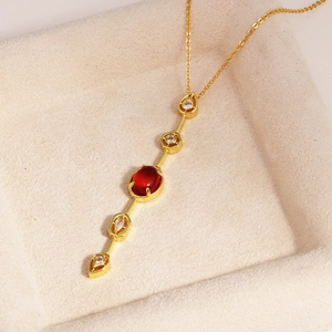 18K gold-plated necklace with oval red gemstone pendant and sparkling side stones