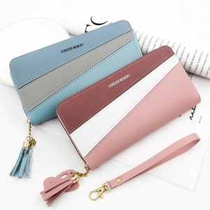 Detail view of long PU leather wallets with wristlets in pastel color block designs