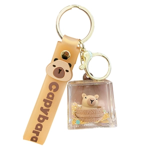 Creative liquid quicksand capybara keychain with brown silicone strap and gold metal ring
