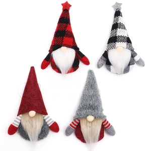 Set of four Christmas gnome ornaments in red grey and plaid patterns with star toppers