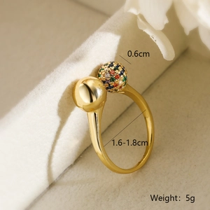 Detail of gold-plated ring with one polished bead and one rainbow zircon pavé bead