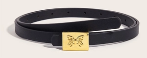 Close-up of black faux leather skinny belt featuring a gold square buckle with butterfly relief