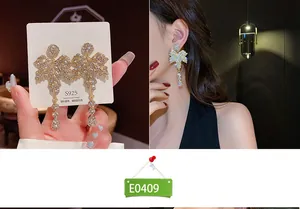 Detailed view of S925 silver maple leaf tassel earrings with sparkling crystals