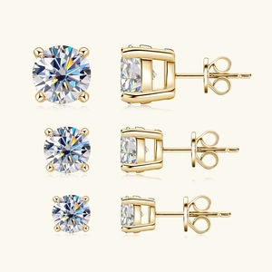 Detail of three sizes of gold six-prong moissanite earrings in 925 sterling silver