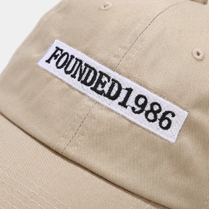 Khaki cotton baseball cap with 1986 embroidery patch and vintage soft top style