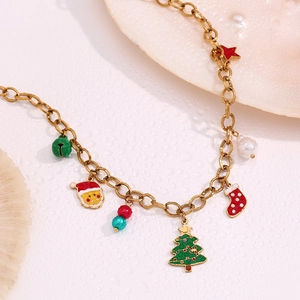 Detail of 18K gold plated chain with enamel Christmas tree and Santa pendants