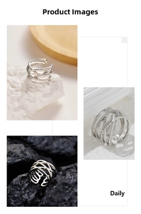 Macro shot of silver multi-layer crisscross stainless steel ring with pavé rhinestones