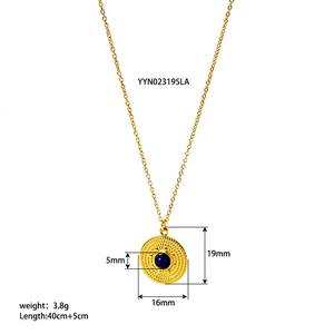 Detailed view of vintage gold necklace with blue stone pendant and size specifications