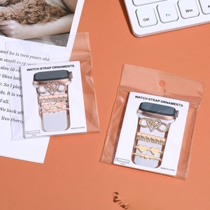 Detail of gold and silver decorative charms for silicone watch bands with rhinestones