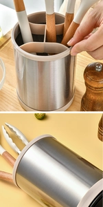 Detail showing revolving stainless steel utensil holder with wooden handle tools