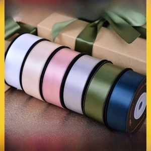 Macro shot of assorted colorful satin ribbons rolls for gift wrapping and decoration