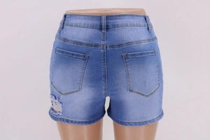 Close-up of blue high waist ripped denim shorts showing back pockets on a mannequin