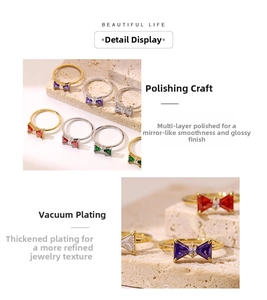 Detailed view of colorful bow rings featuring vibrant zircons and polished plating