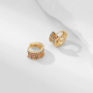 Macro shot of small square gold hoop earrings with colorful cubic zirconia pavé stones