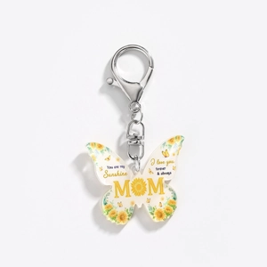 Detail of butterfly acrylic keychain with Mom sunflower print and silver metal ring