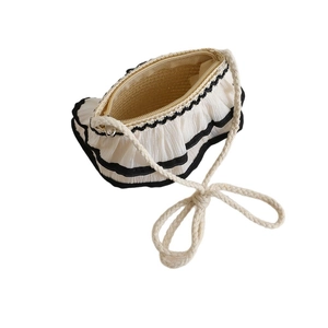 Summer woven straw crossbody bag for girls with white pleated lace trim and bow strap