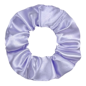 Detailed close-up of lilac satin scrunchie with silky luster and elastic folds texture